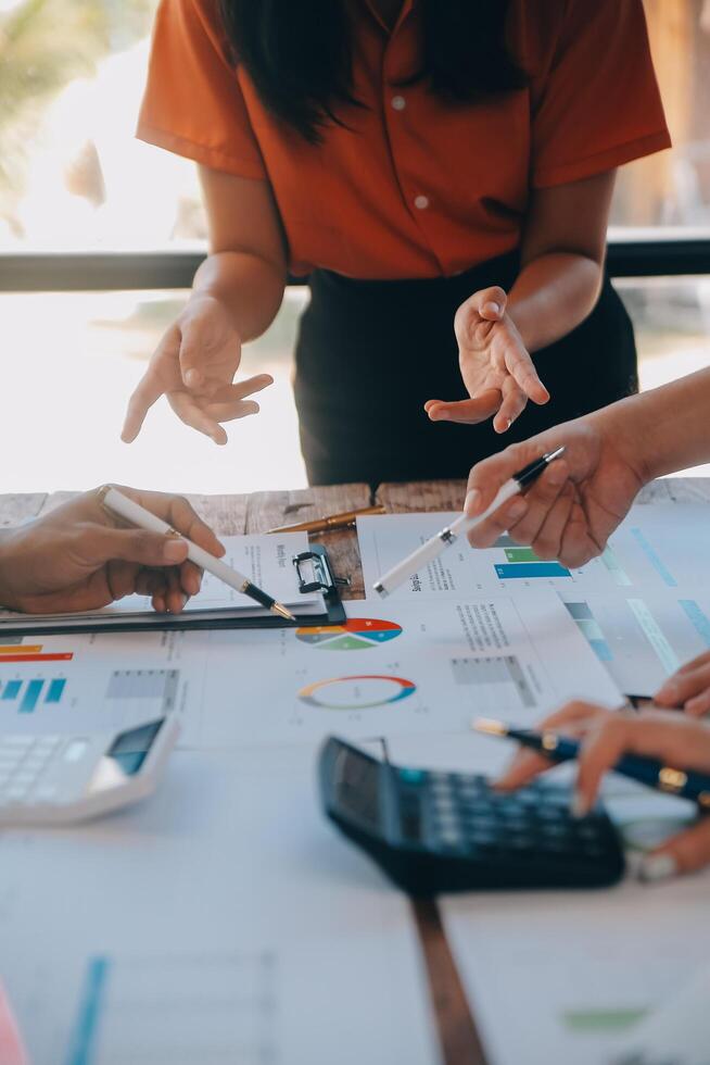 Co working conference, Business team meeting present, investor colleagues discussing new plan financial graph data on office table with laptop and digital tablet, Finance, accounting, investment. photo