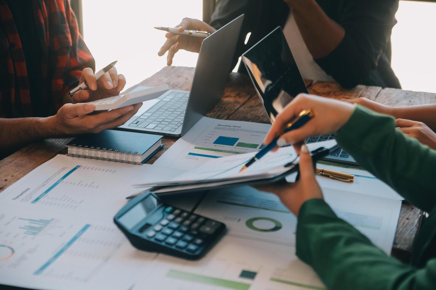 Co working conference, Business team meeting present, investor colleagues discussing new plan financial graph data on office table with laptop and digital tablet, Finance, accounting, investment. photo