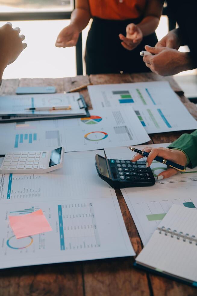 Co working conference, Business team meeting present, investor colleagues discussing new plan financial graph data on office table with laptop and digital tablet, Finance, accounting, investment. photo