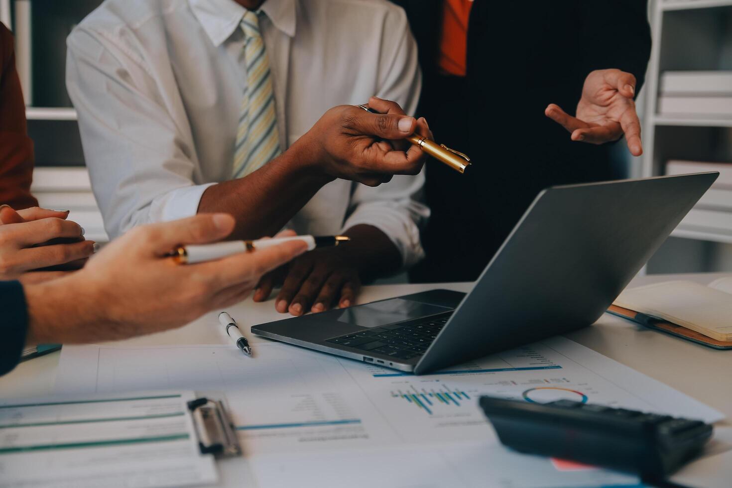 Co working conference, Business team meeting present, investor colleagues discussing new plan financial graph data on office table with laptop and digital tablet, Finance, accounting, investment. photo