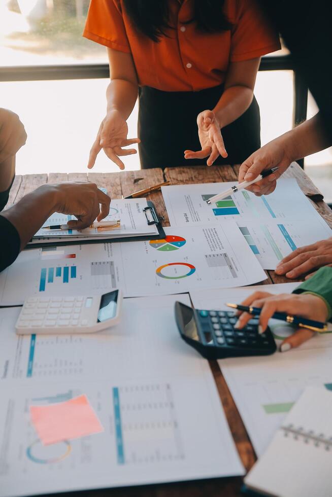 Co working conference, Business team meeting present, investor colleagues discussing new plan financial graph data on office table with laptop and digital tablet, Finance, accounting, investment. photo