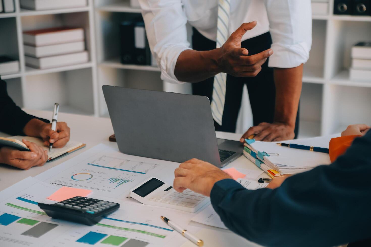 Co working conference, Business team meeting present, investor colleagues discussing new plan financial graph data on office table with laptop and digital tablet, Finance, accounting, investment. photo