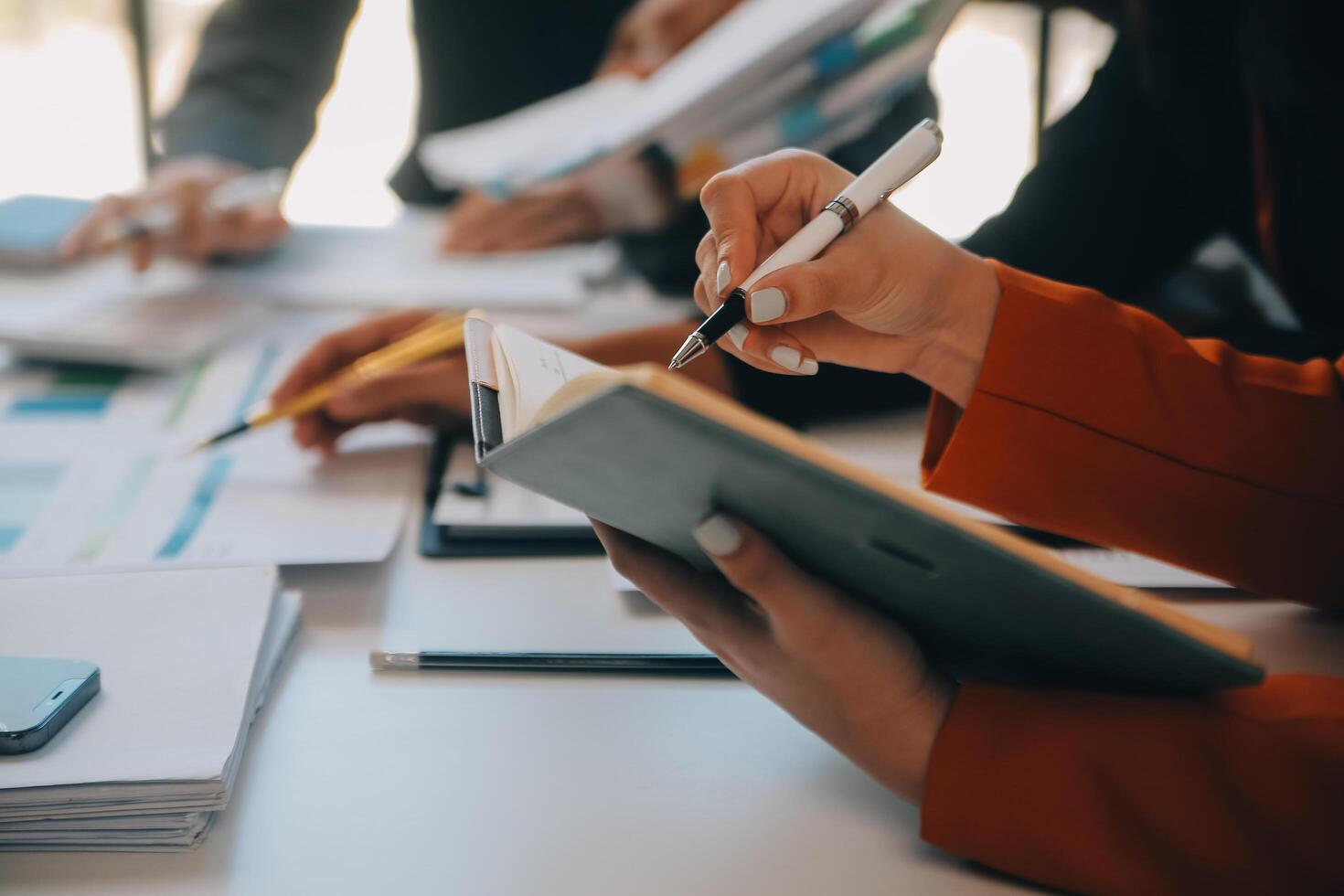 Business team working with new startup project plan and discussion information for financial strategy with laptop and digital tablet in a modern business lounge. photo