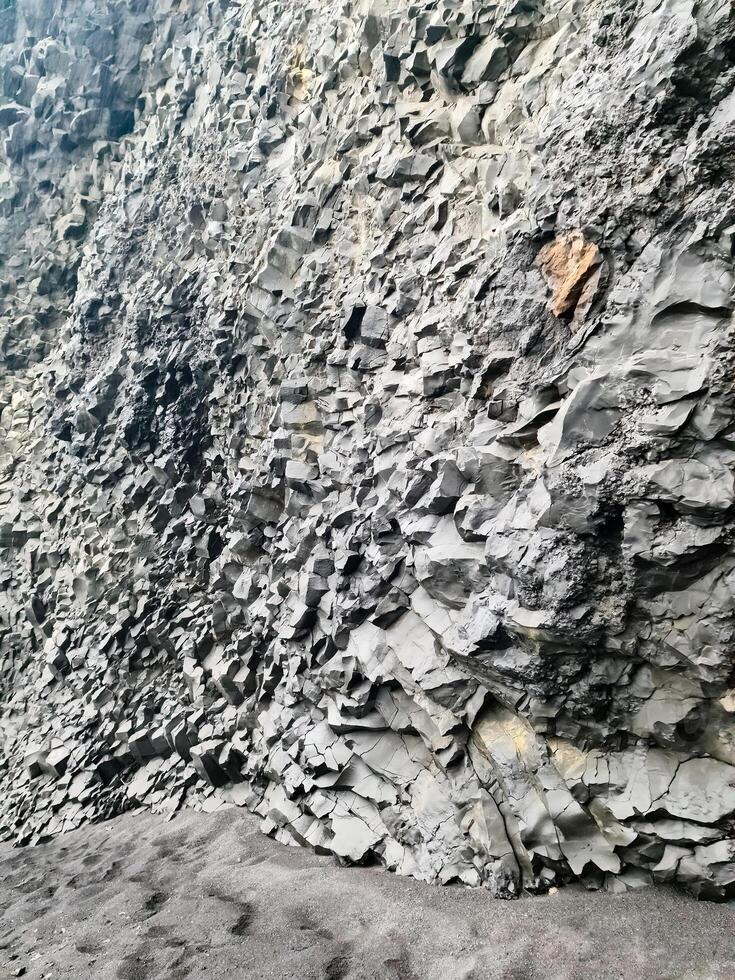 Amazing basalt rock structures at Endless Black Beach of Iceland. photo