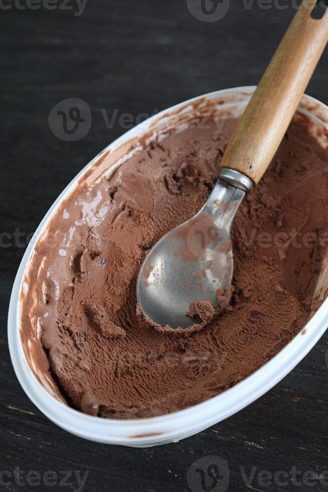 Store Bought Chocolate Chips Ice Cream with Icecream Scoop photo