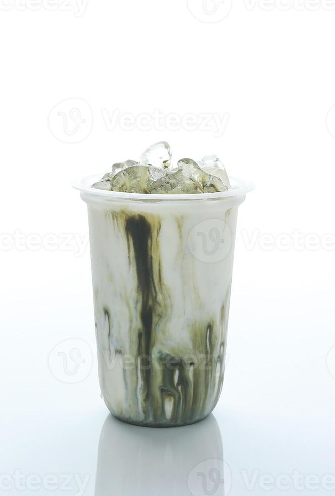 Glass of Iced Matcha Latte, Ice Green Tea with Freh Milk on Plastic Cup. photo