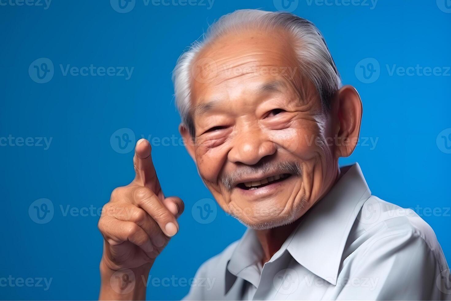 AI generated Asian grandfather looking and smiling with rised index finger on blue background, neural network generated art photo