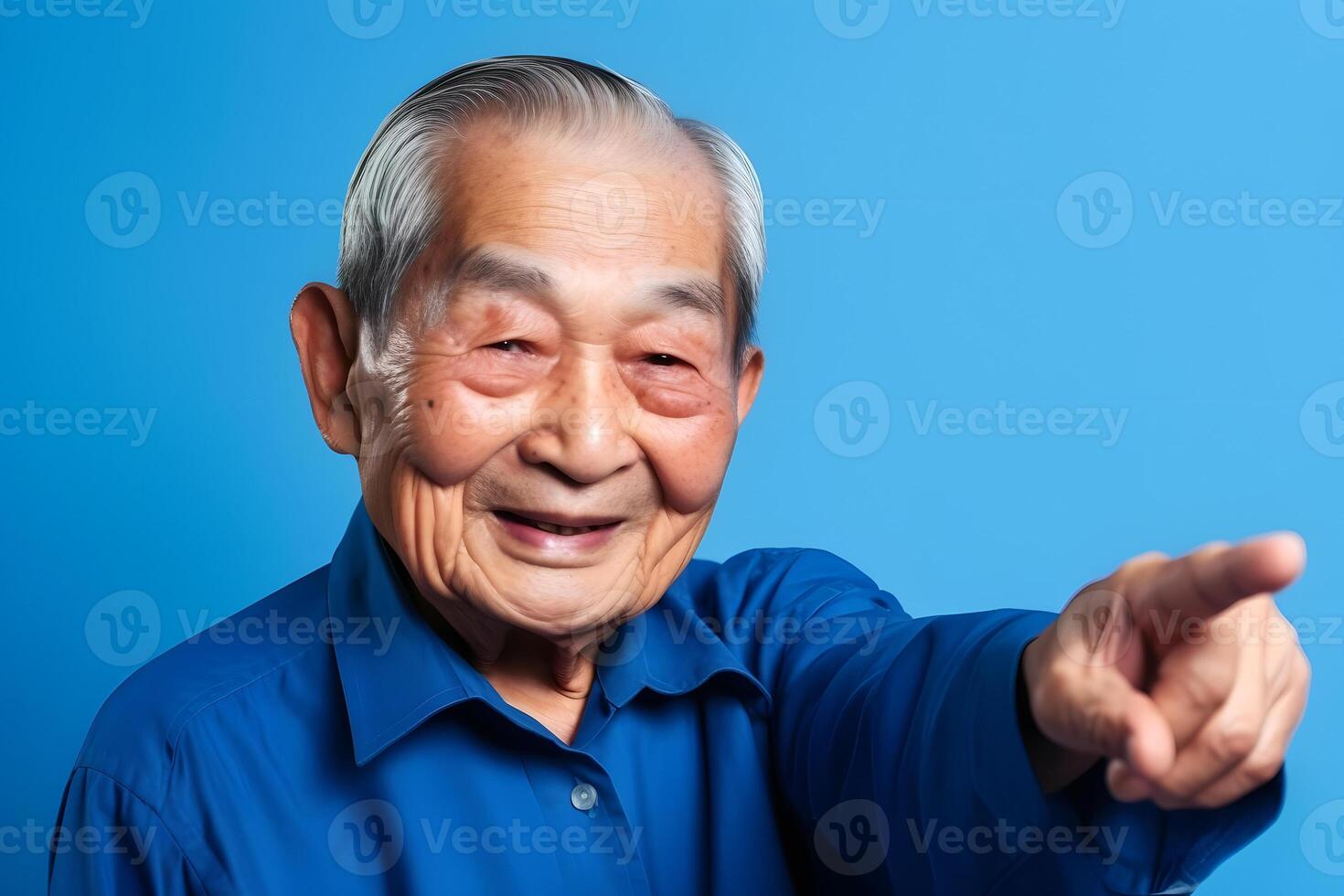 AI generated Asian grandfather looking and smiling with rised index finger on blue background, neural network generated art photo