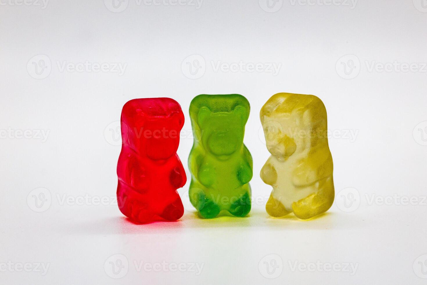 Colorful Gummy Bears in a Row on White Background photo