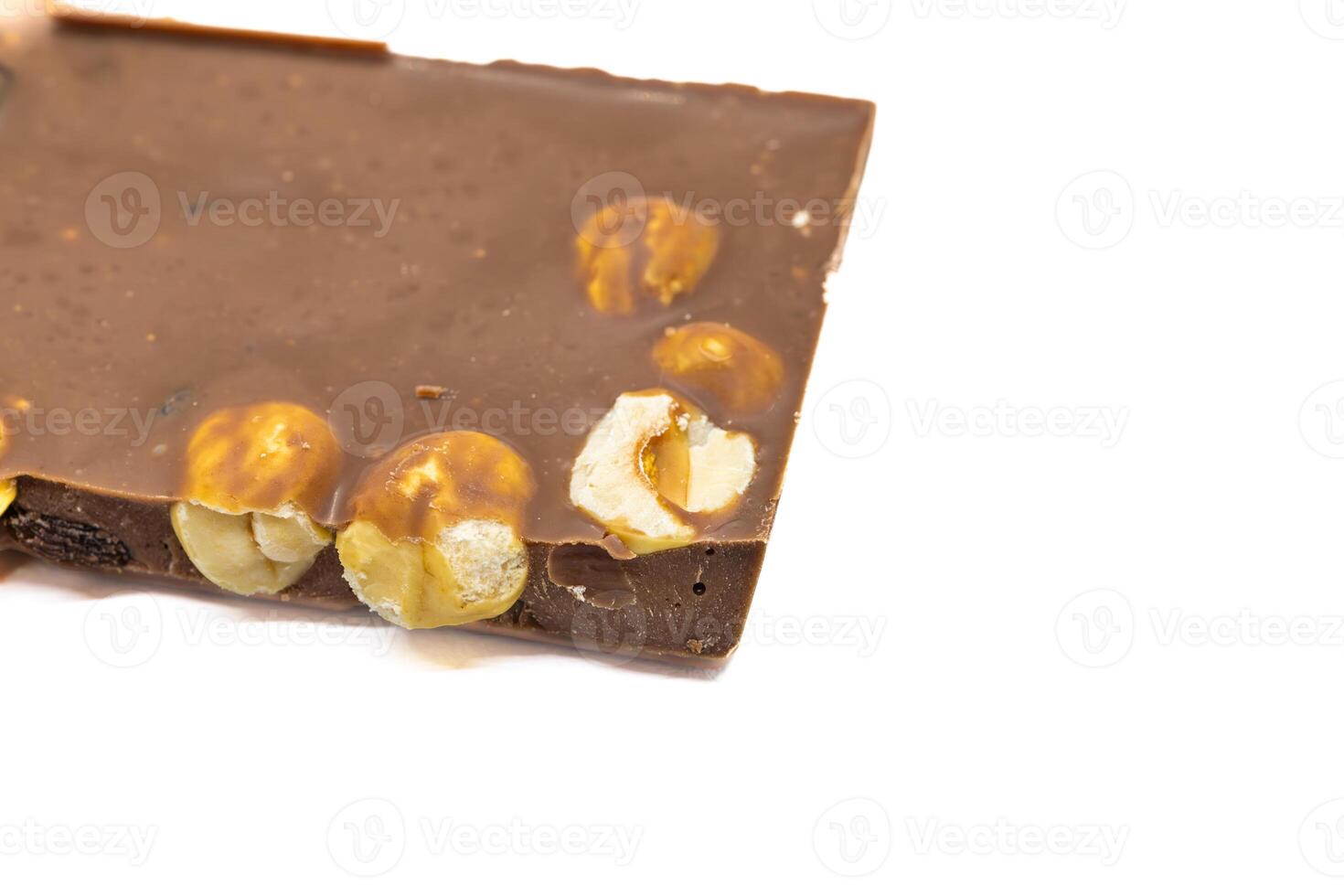 Milk Chocolate Bar with Hazelnuts on White Background photo