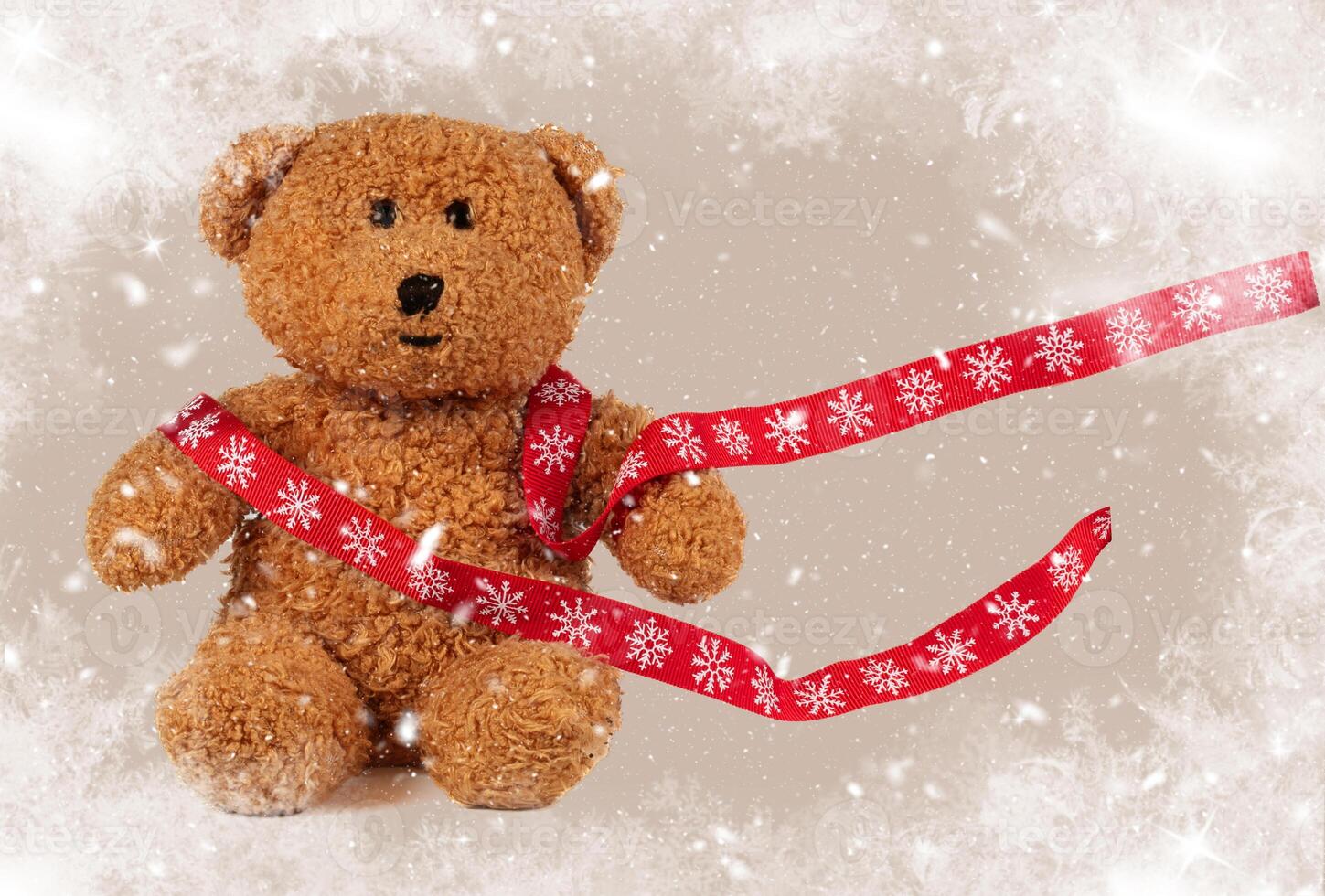 Christmas toy vintage bear with a flying red ribbon on a retro background. Children's New Year's card with a bear covered in snow. photo