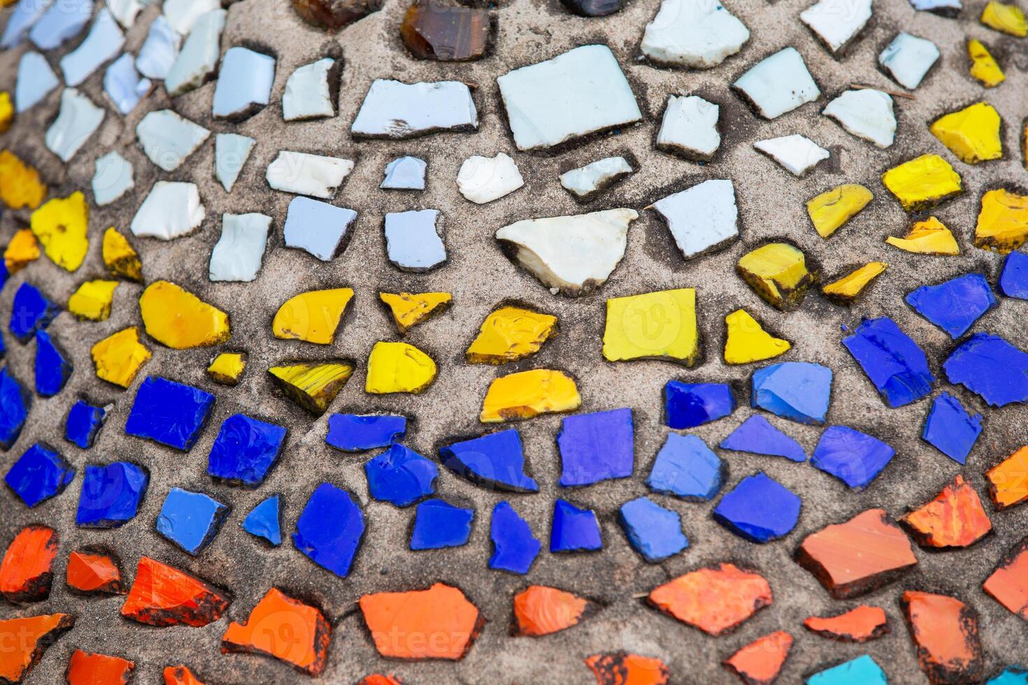 Mosaic panel made of multi-colored pieces of ceramics. Background inlay, mosaic photo