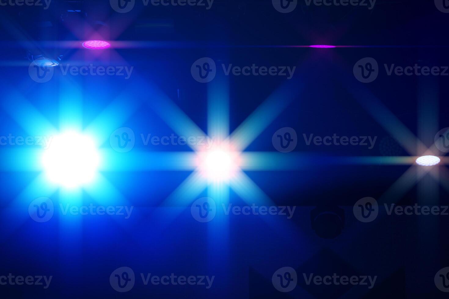 Bright multi-colored iridescent lights of stage lighting. Background scene, performance. Concert light. photo