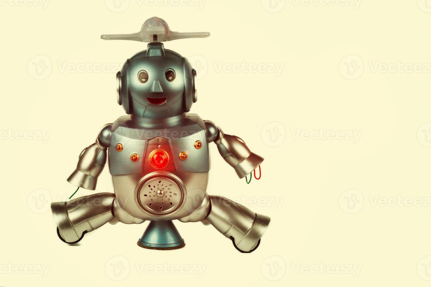 Vintage toy robot on a beige background. Robotics. photo