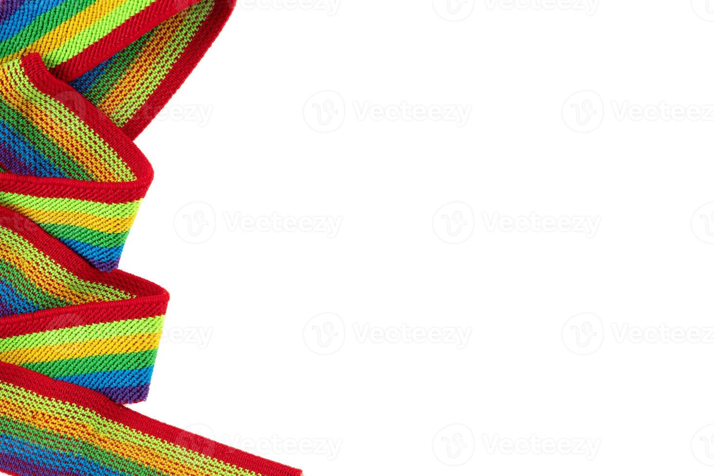 Colorful rainbow ribbon closeup isolated on white background. Colorful LGBT design. Curly, fluttering ribbon. photo