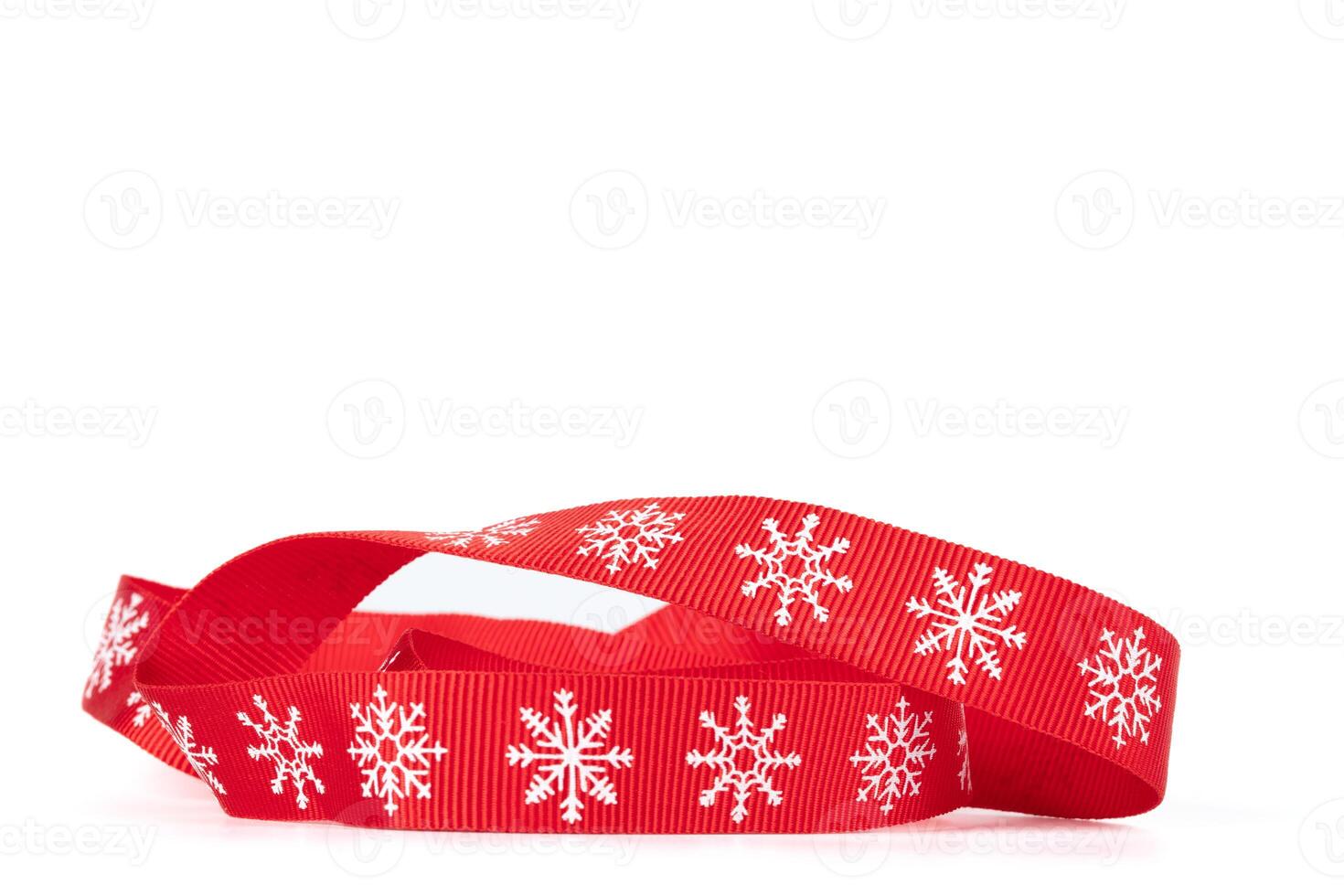 Christmas red ribbon with white snowflakes isolated. photo