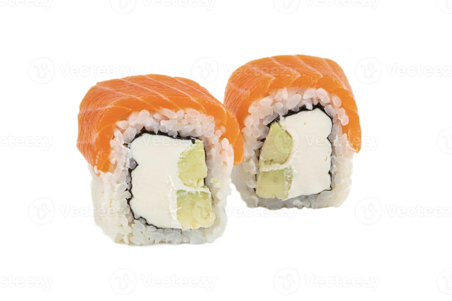 Sushi closeup isolated on white background. Sushi roll baked with red fish, trout, Philadelphia cheese and daikon. Japanese restaurant menu. photo