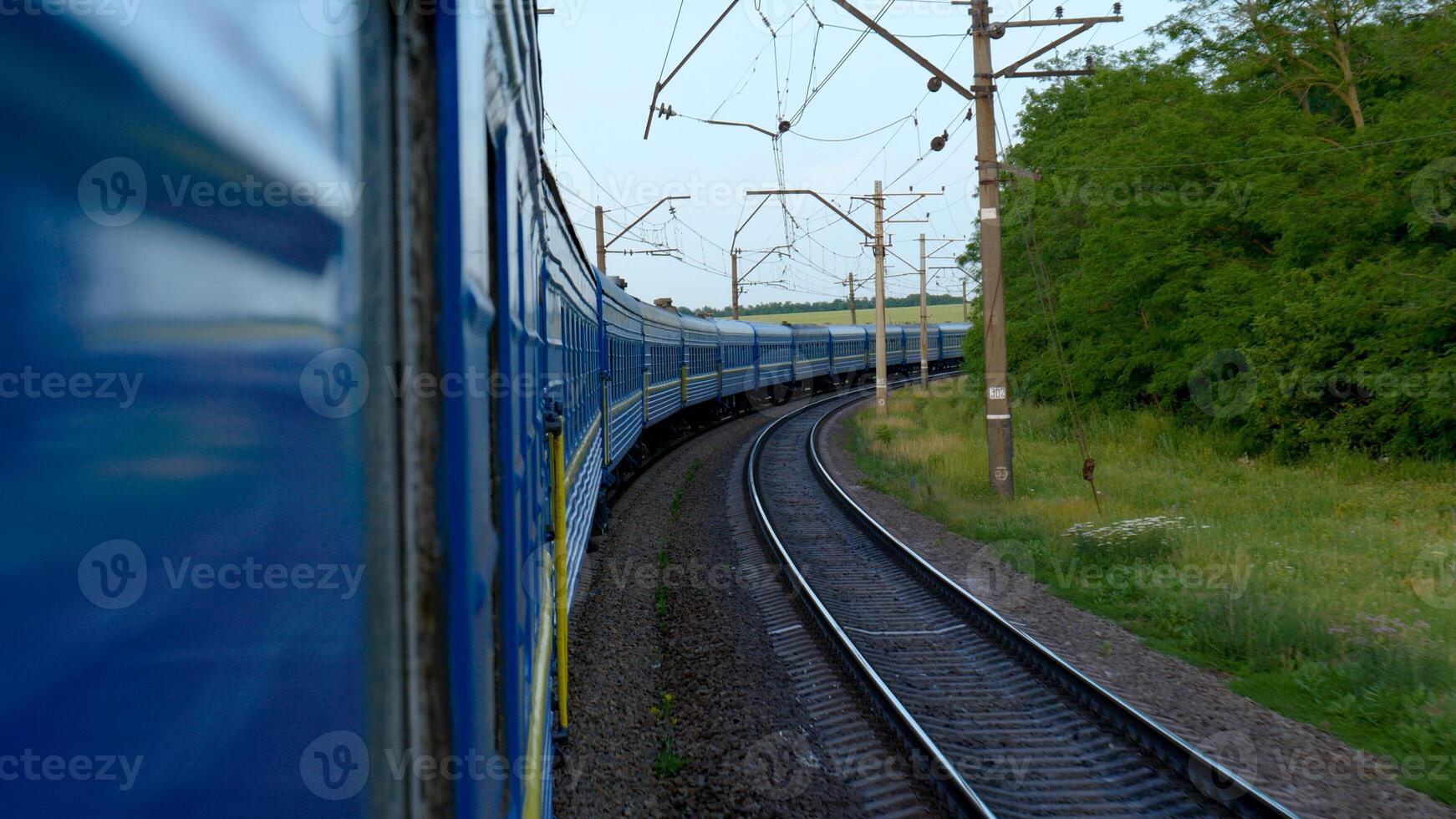 Transport, travel, road, railway, landscape, comnication concept - View from train window in motion photo