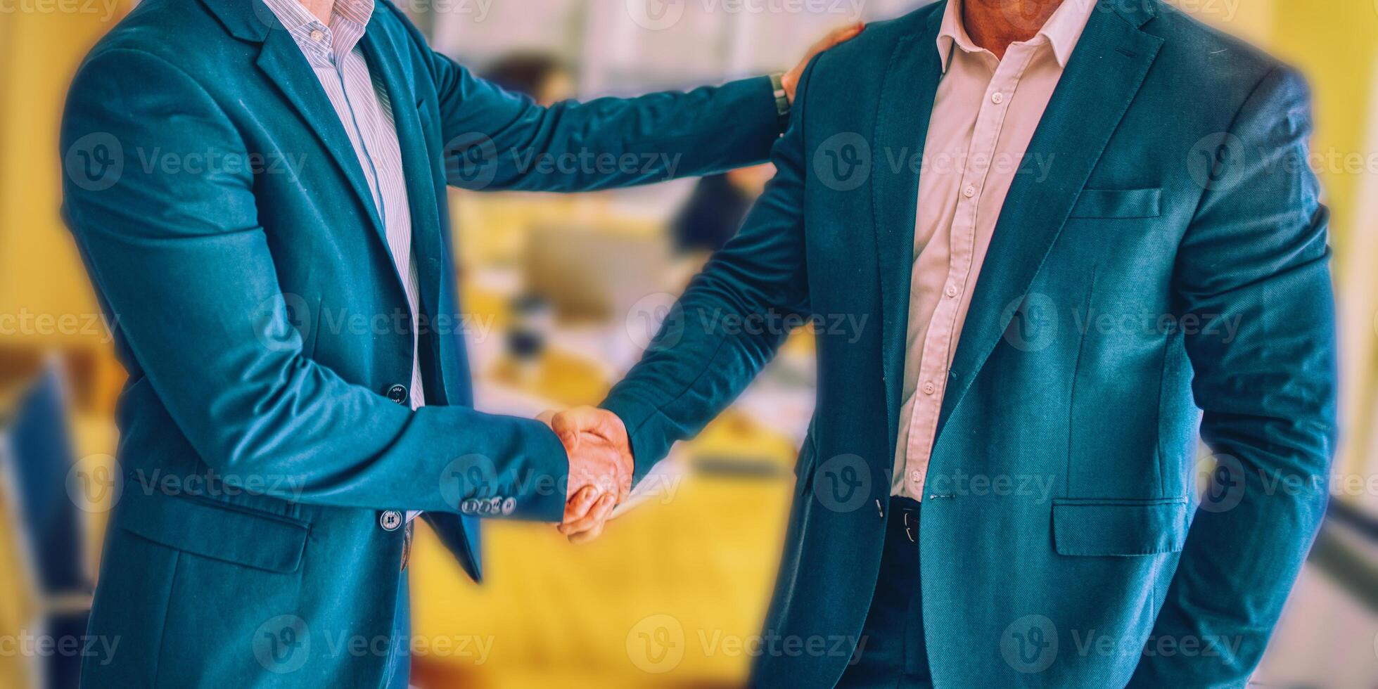 Two business man making handshake in the city. Business etiquette, congratulation, merger and acquisition concepts. photo