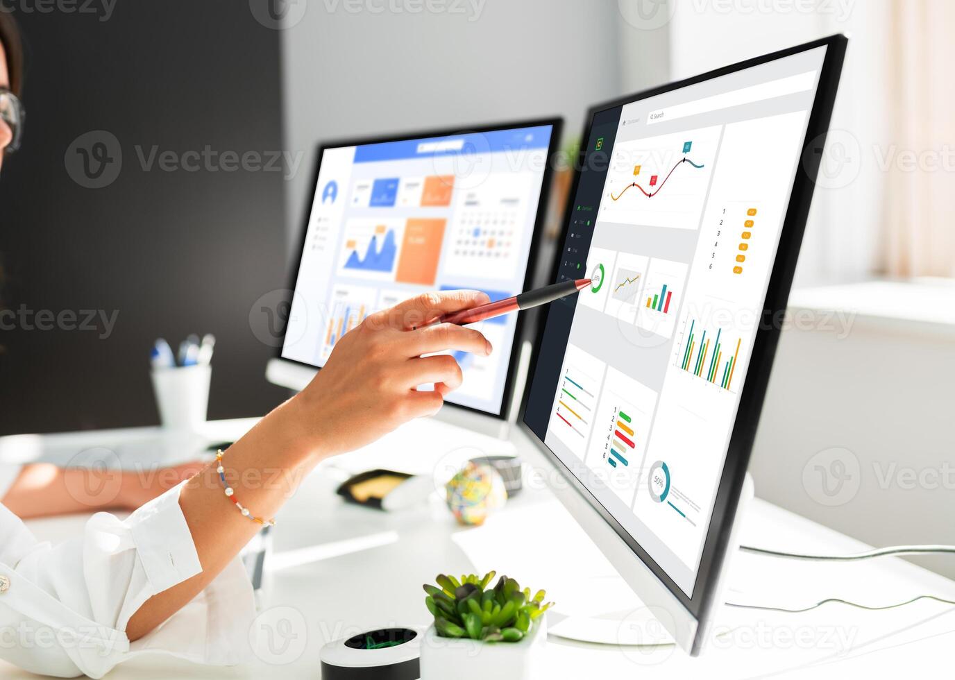 Analyst working on data analysis or BI dashboard on computer monitor. Business team analyzing financial data by Fintech in corporate office for business marketing and strategy planning. Trailblazing photo