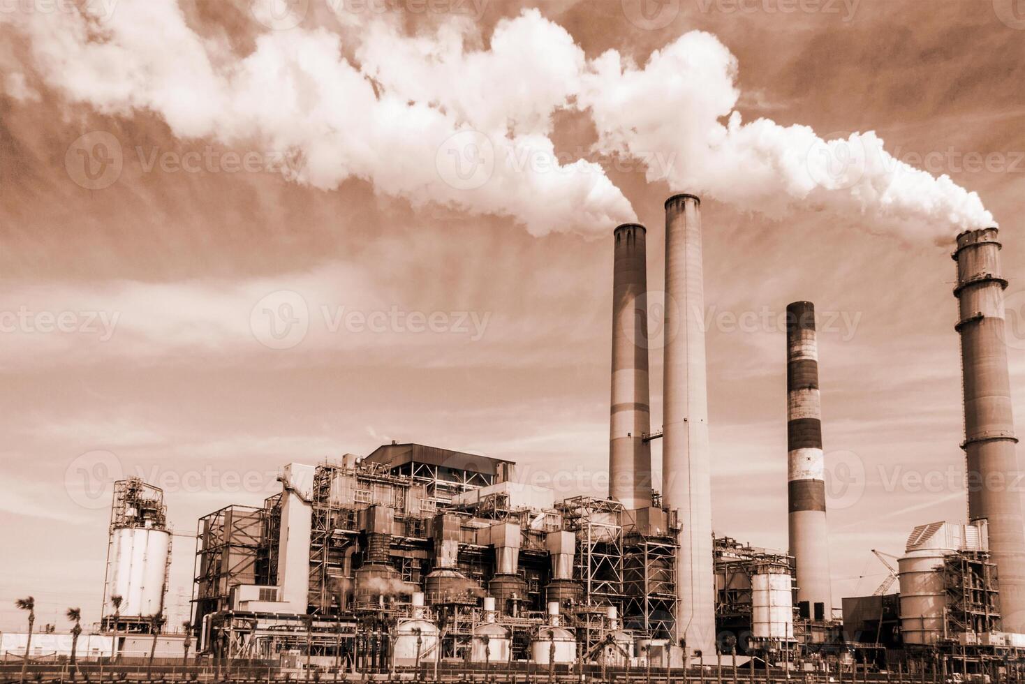 View of the thermal power plant, smoke from the chimney. Concept air pollution, global warming Toned image photo