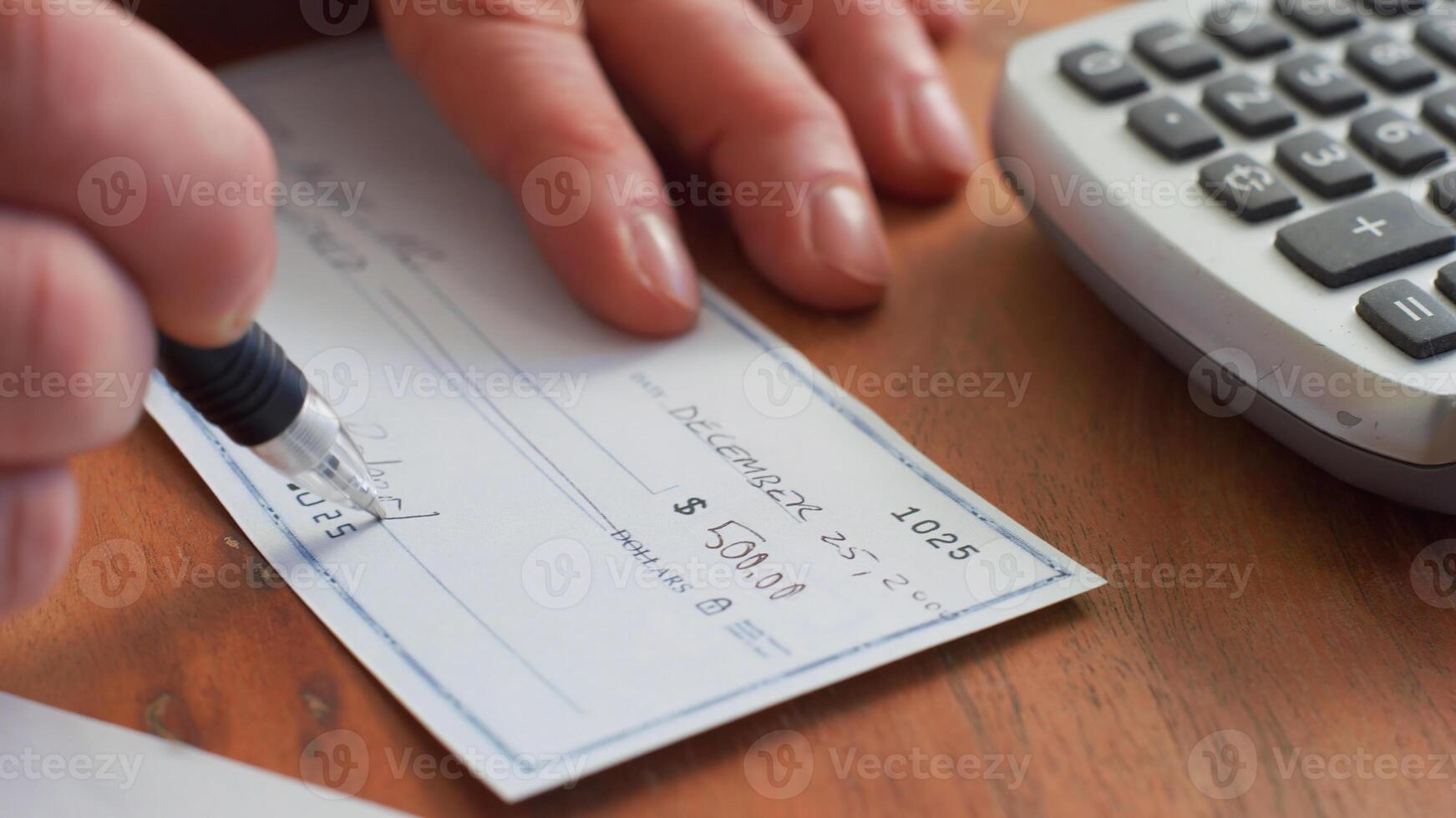 Writing a cheque Check, Currency, Paying. photo