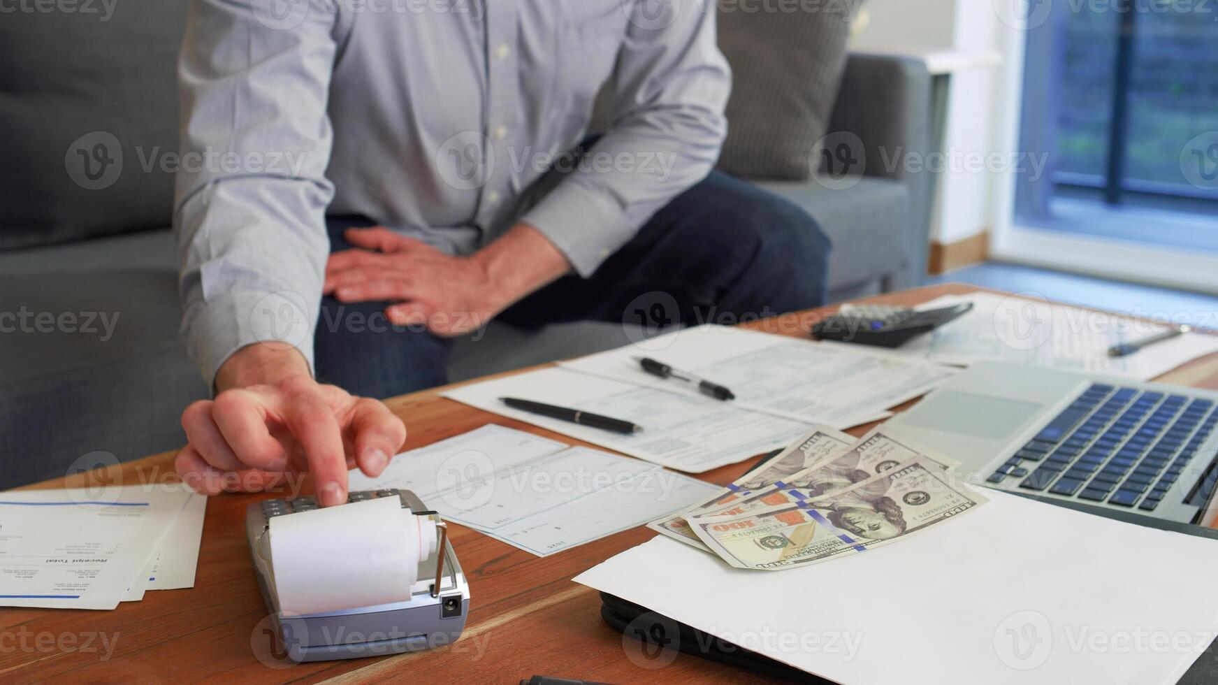Business accounting concept, Business man using calculator with computer laptop, budget and loan paper in office. photo