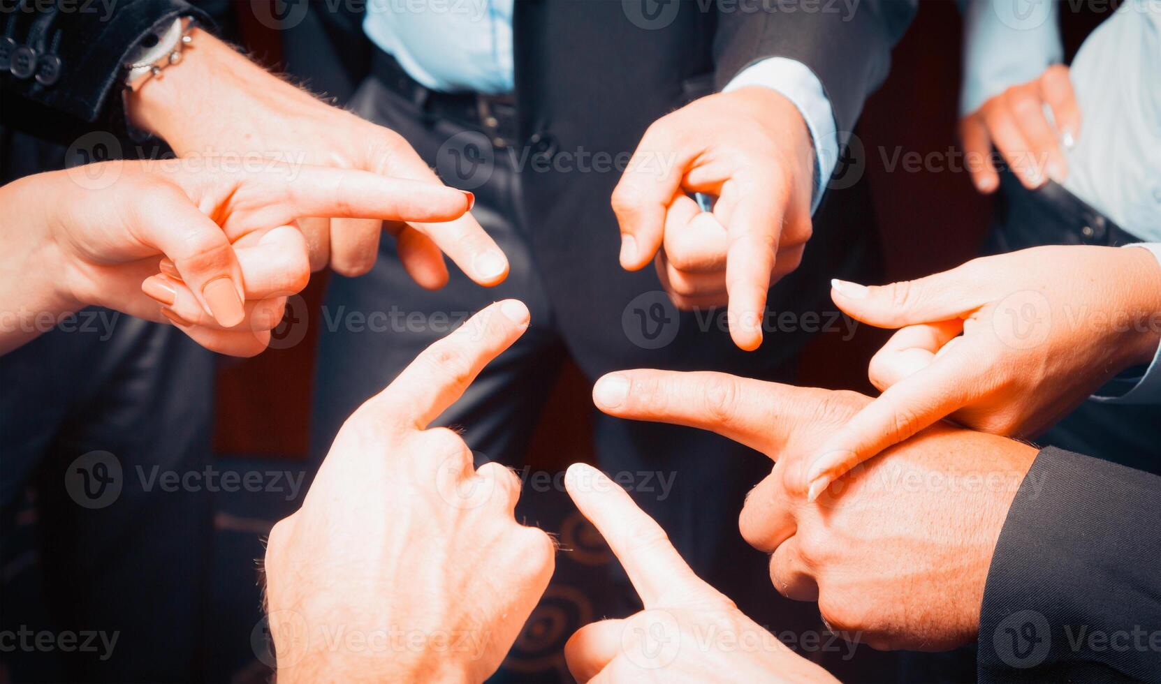 Many hands pointing ahead or out photo