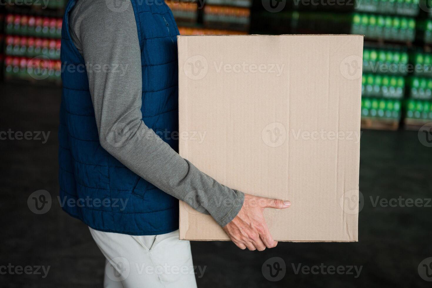 Cardboard box shipping concept Man is holding a brown parcel photo
