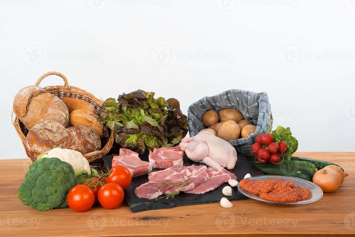 Fresh raw meat and vegetables on a table photo