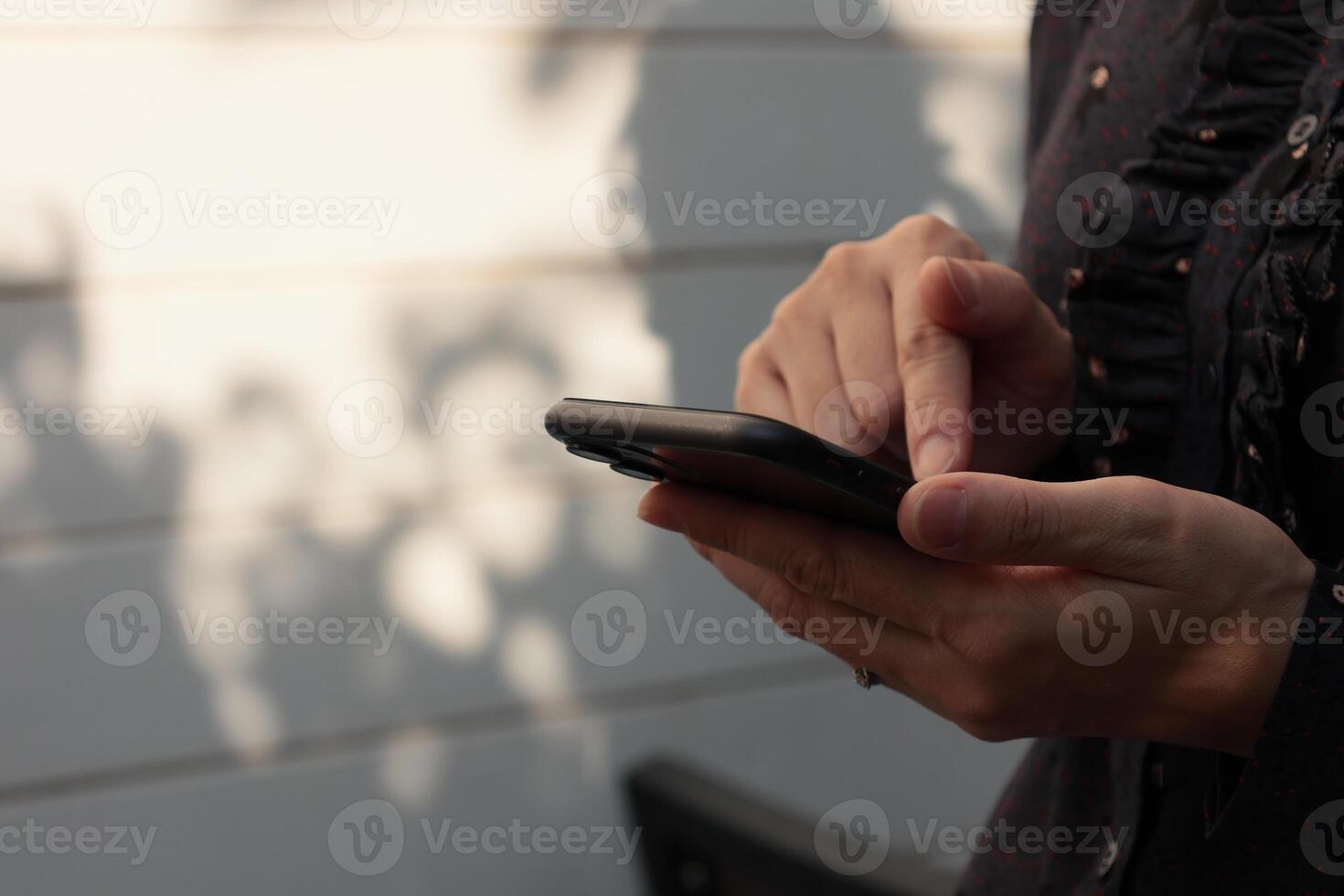 Using smartphone, phone in hand photo