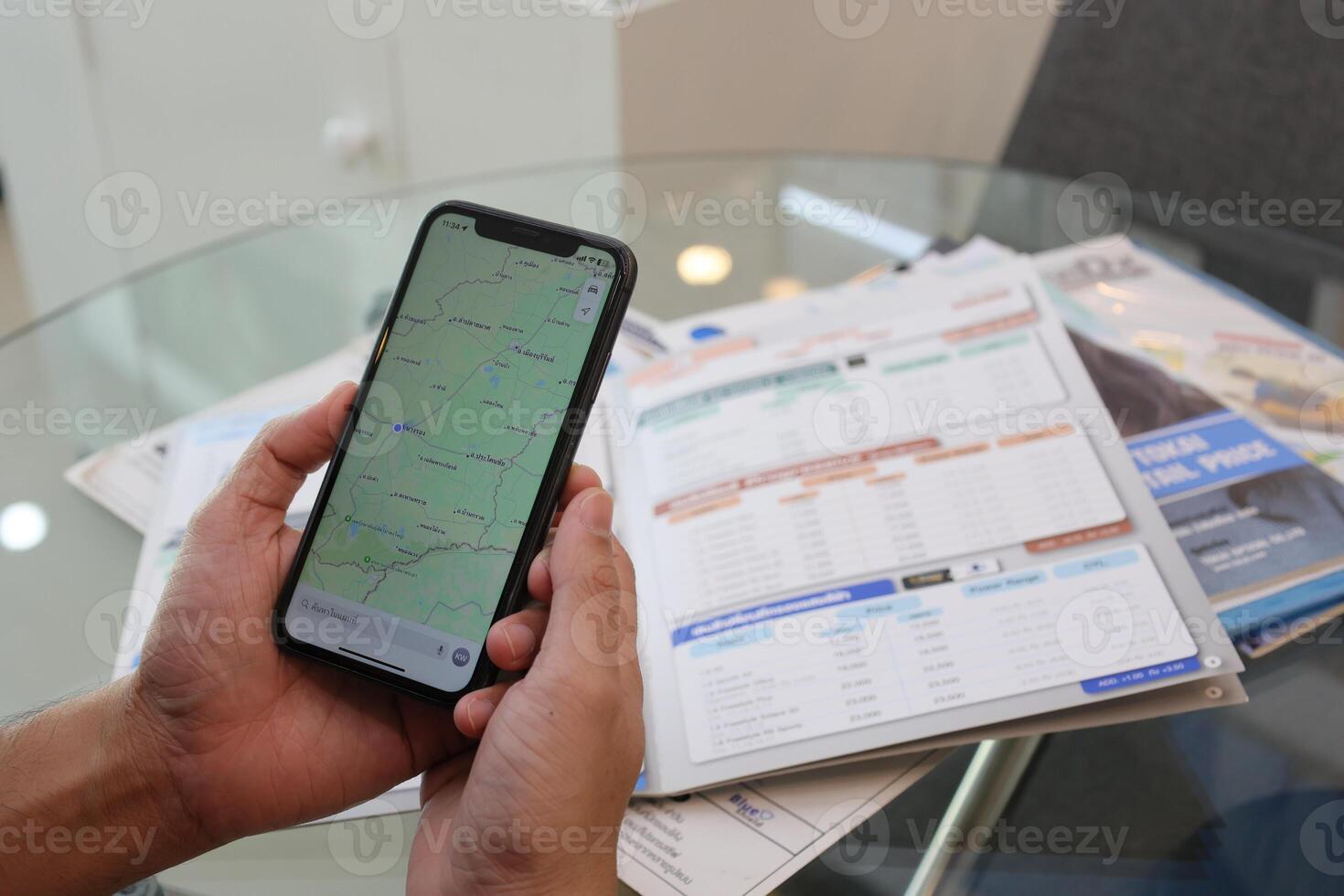 Using smartphone, hand holding phone, working from home photo