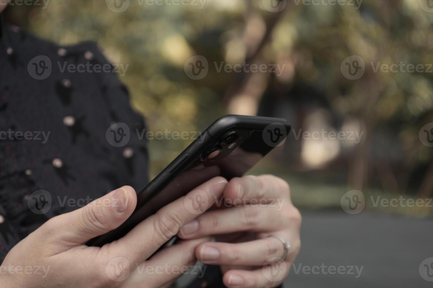 Using smartphone, phone in hand photo