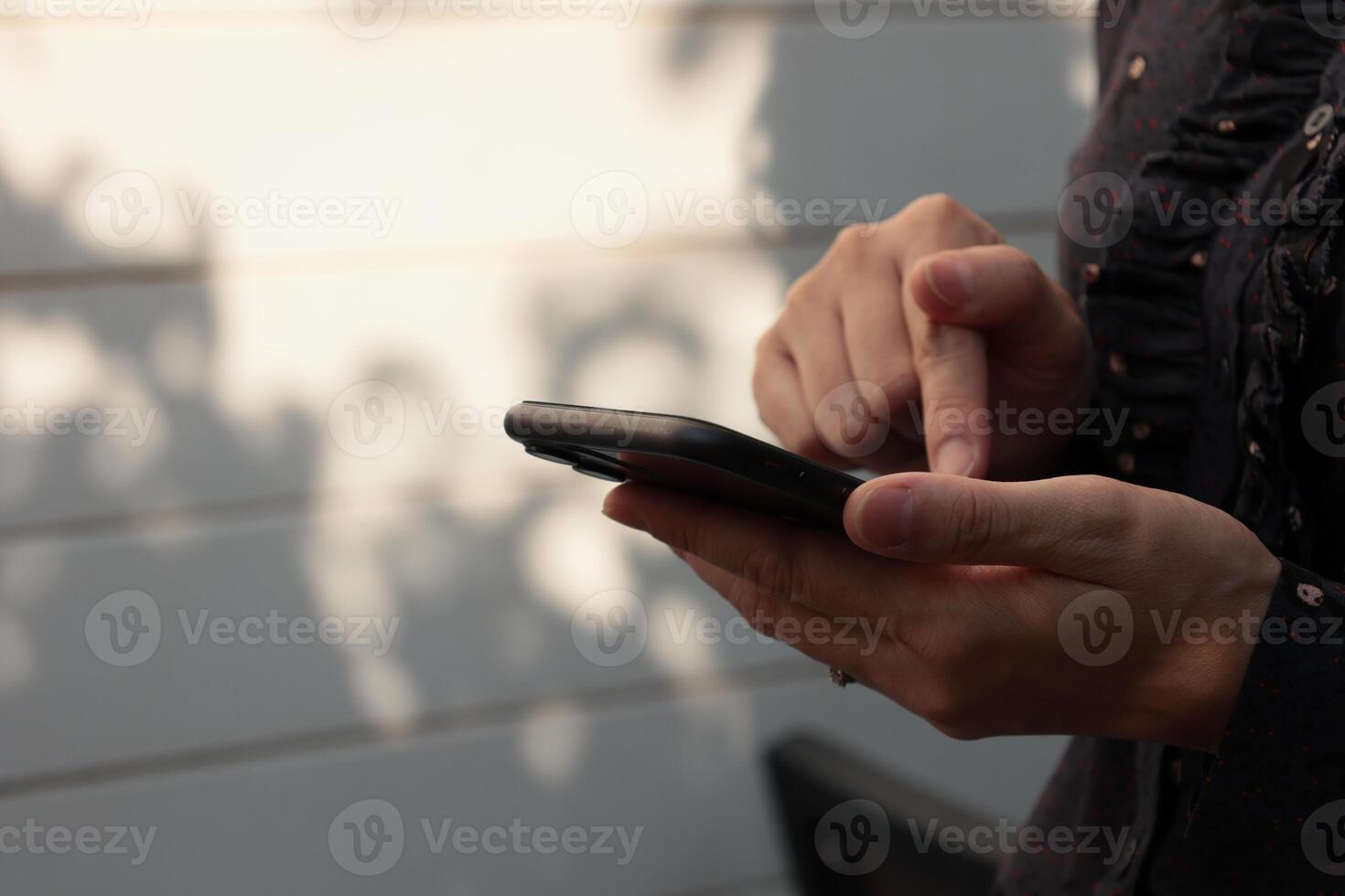 Using smartphone, phone in hand photo