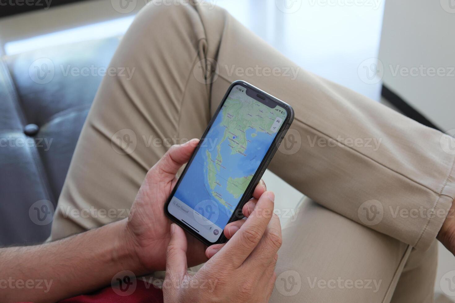 Using smartphone, hand holding phone, working from home photo