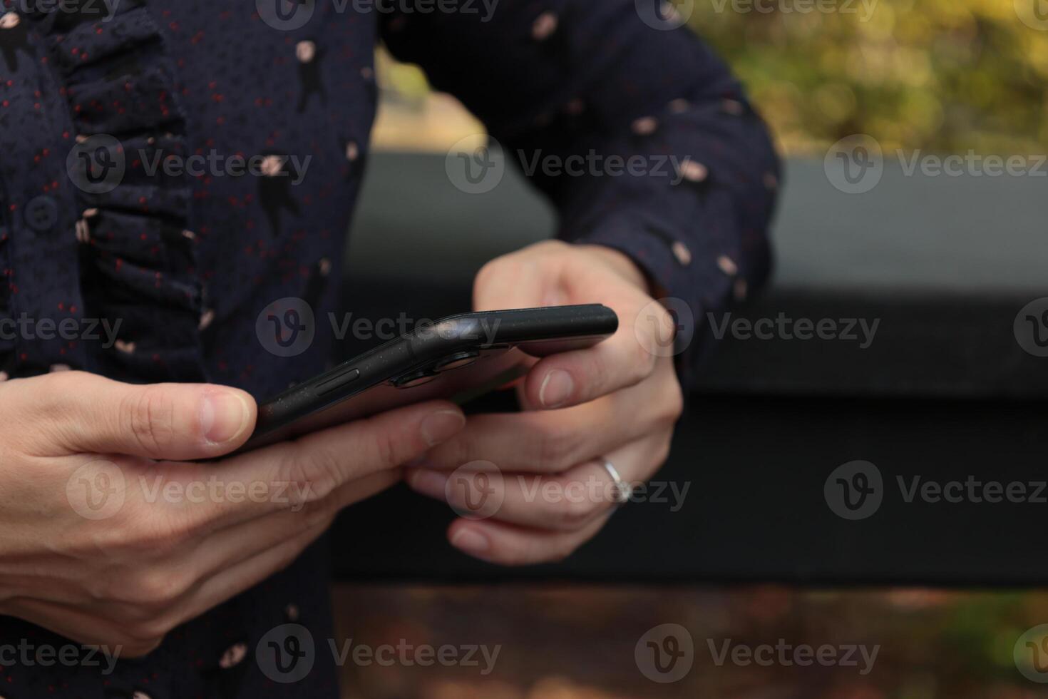 Using smartphone, phone in hand photo
