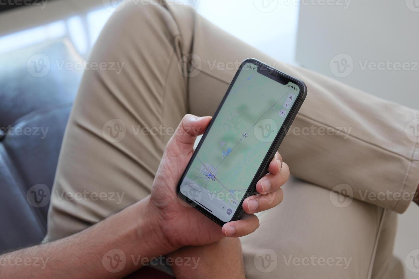 Using smartphone, hand holding phone, working from home photo