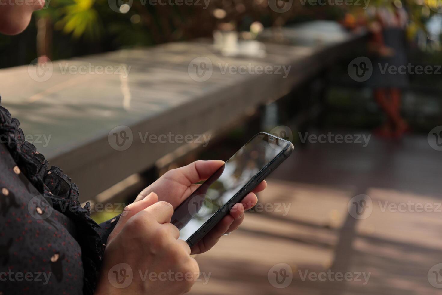 Using smartphone, phone in hand photo