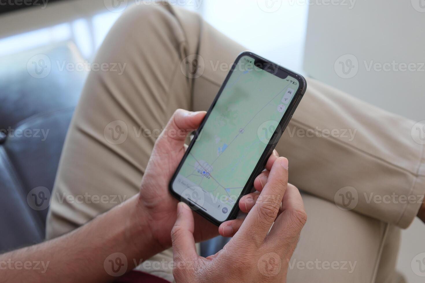 Using smartphone, hand holding phone, working from home photo
