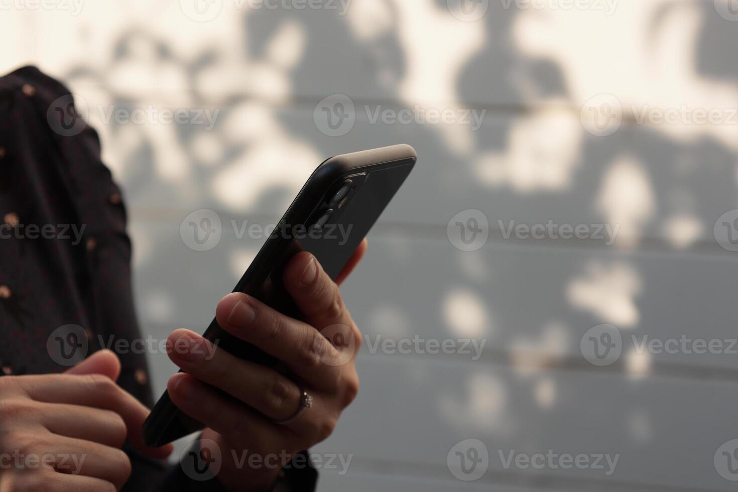 Using smartphone, phone in hand photo
