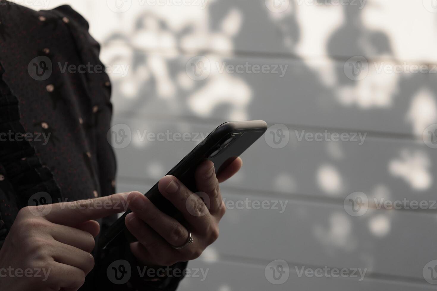 Using smartphone, phone in hand photo