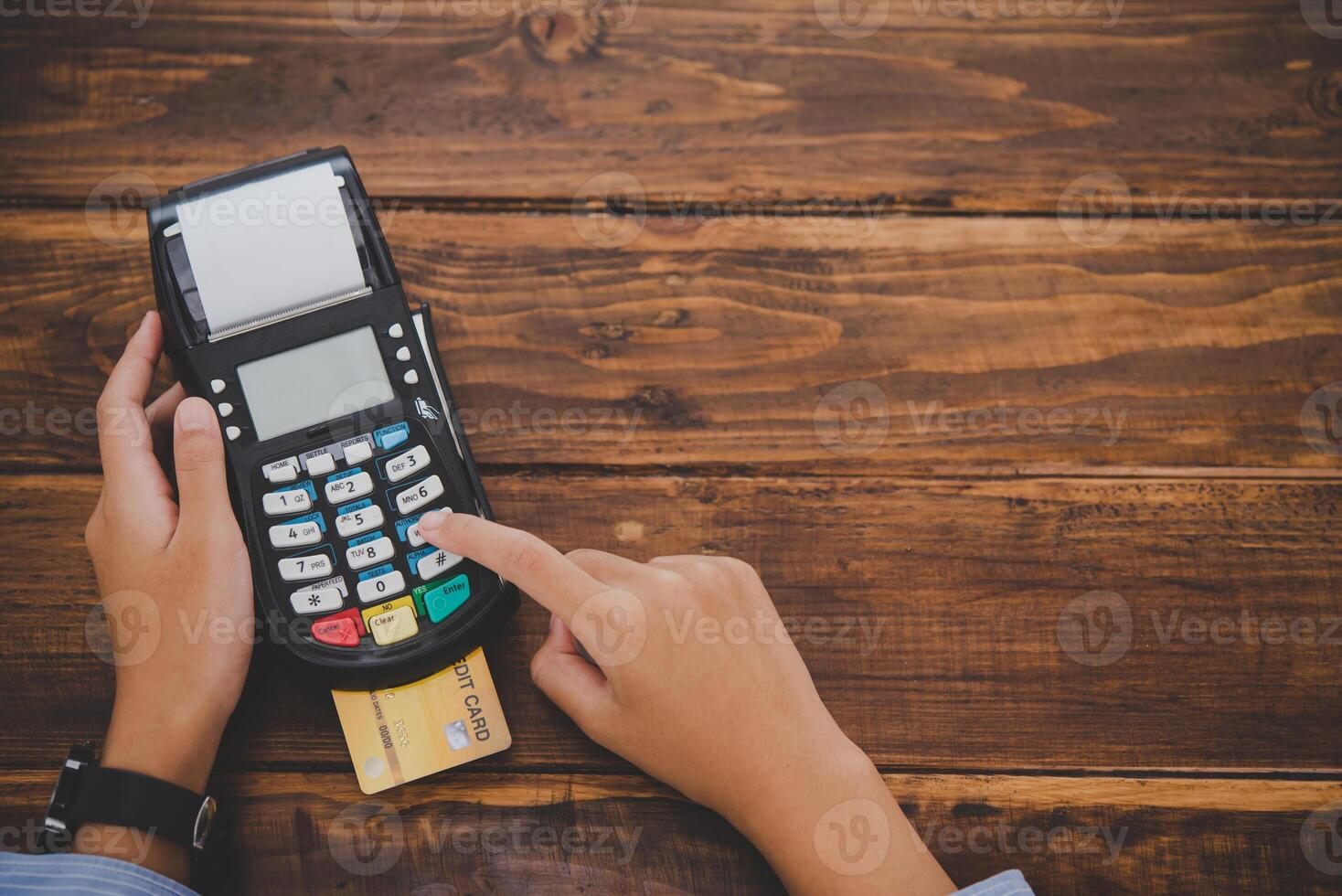 Top view Paying by credit card , buying and selling products using a credit card swipe machine photo