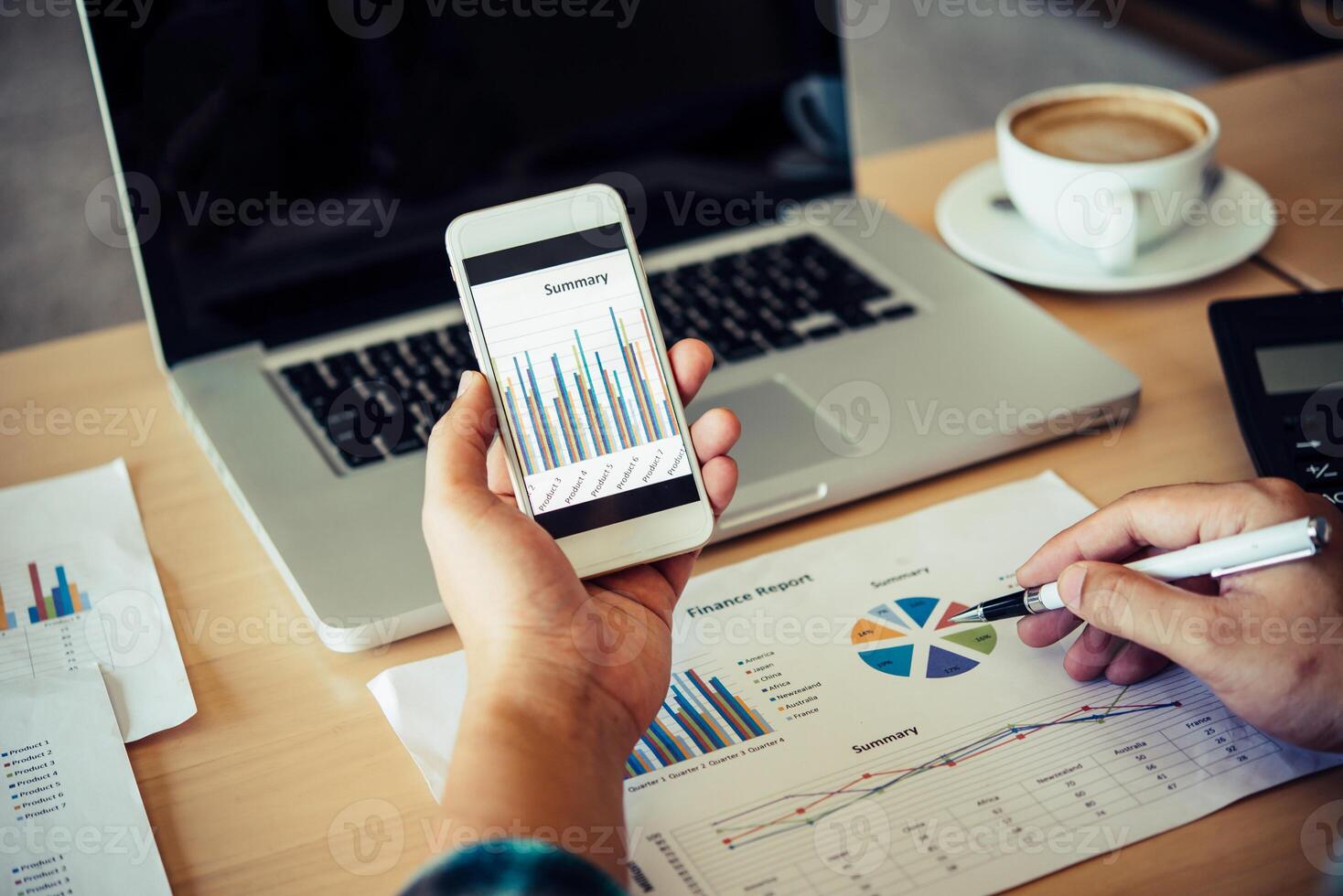 documents graphs and smartphone , analyzing investment chart working in office.Meeting report in progress. Business work concept picture of economy, market, office,money a photo