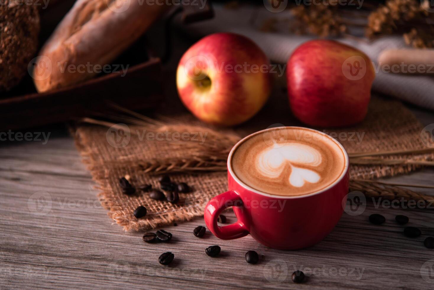 Red coffee glass rests on wood floor. concept still life photo