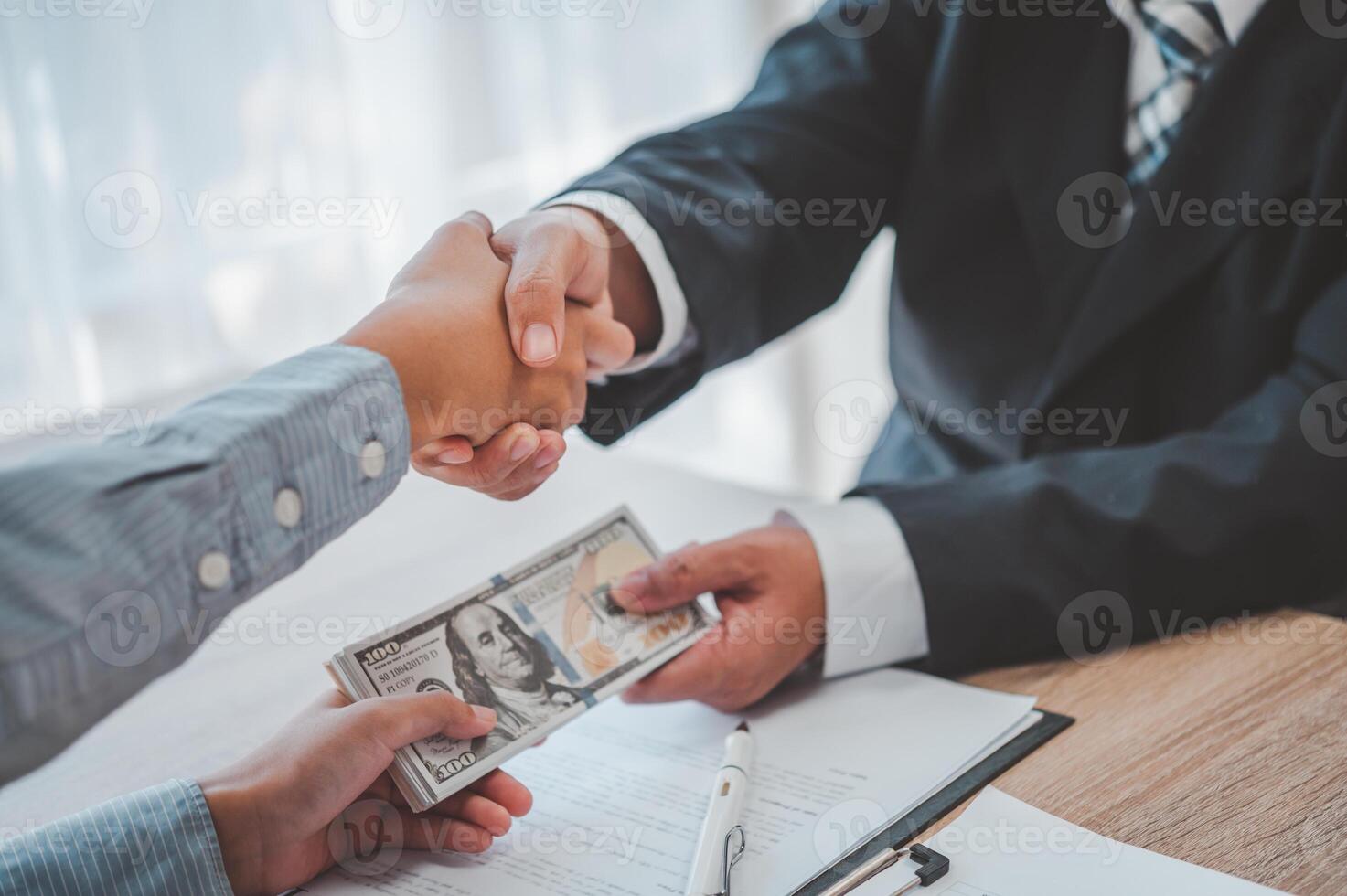businessman was negotiating a bribery arrangement in which the dollar would be accepted as a bribe. Concepts of anti-bribery and anti-corruption photo