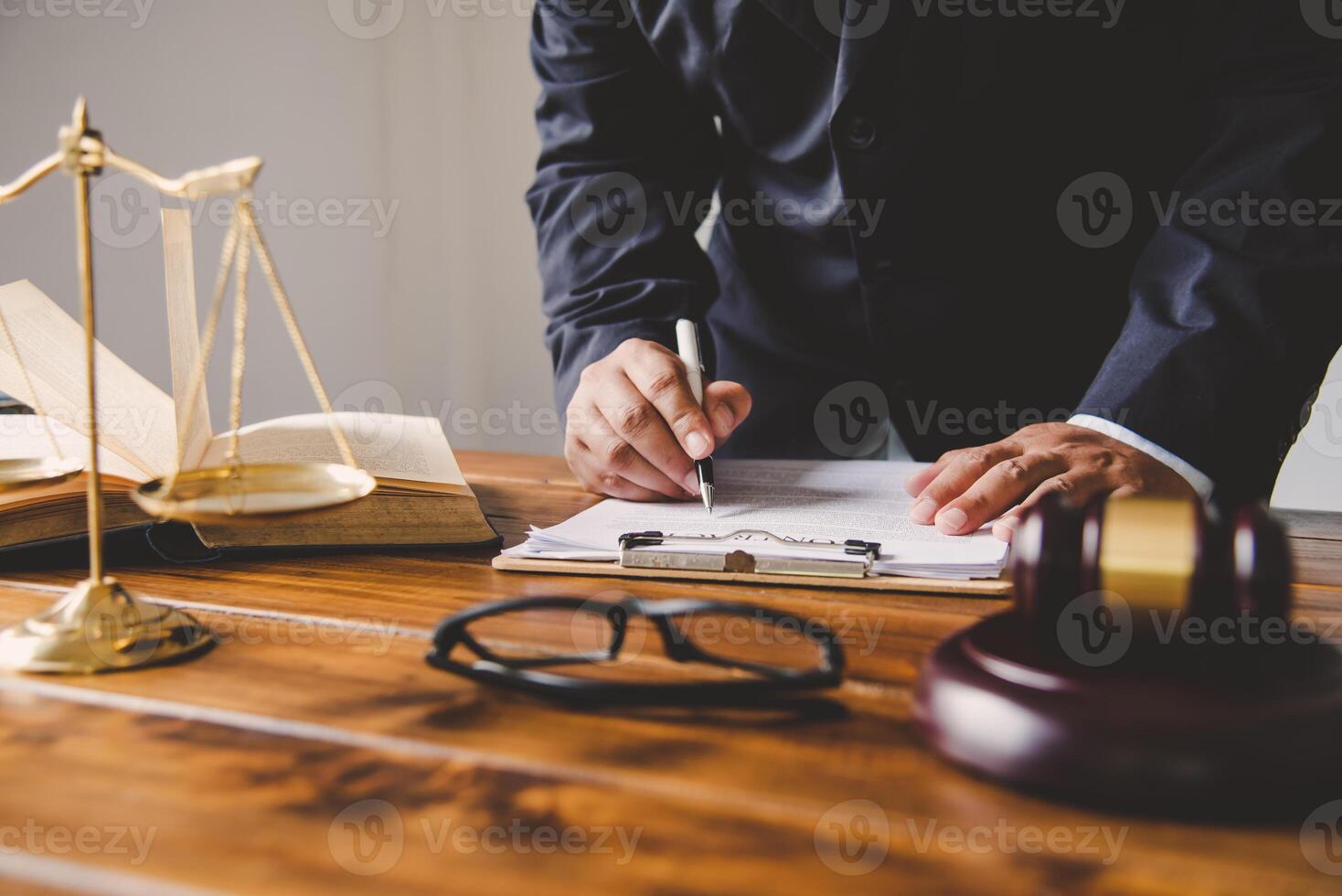 Law theme, mallet of the judge, law enforcement officers, evidence-based cases, and documents taken into account. photo