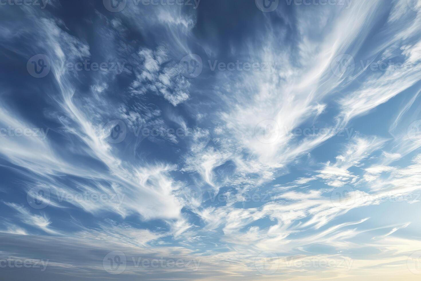 Photo of some white whispy clouds and blue sky cloudscape