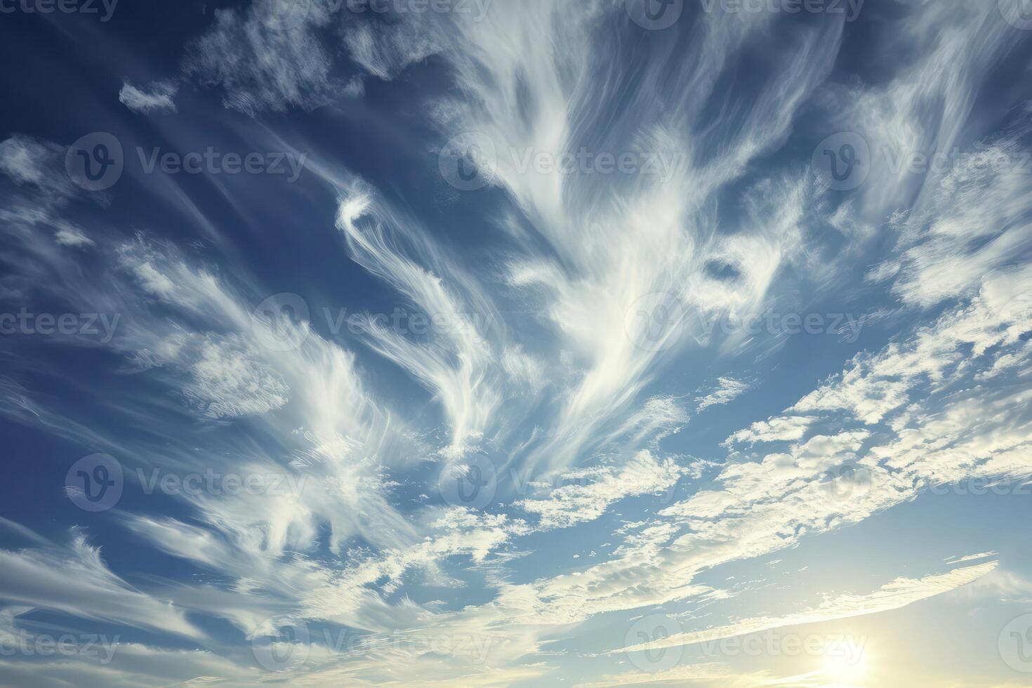 Photo of some white whispy clouds and blue sky cloudscape