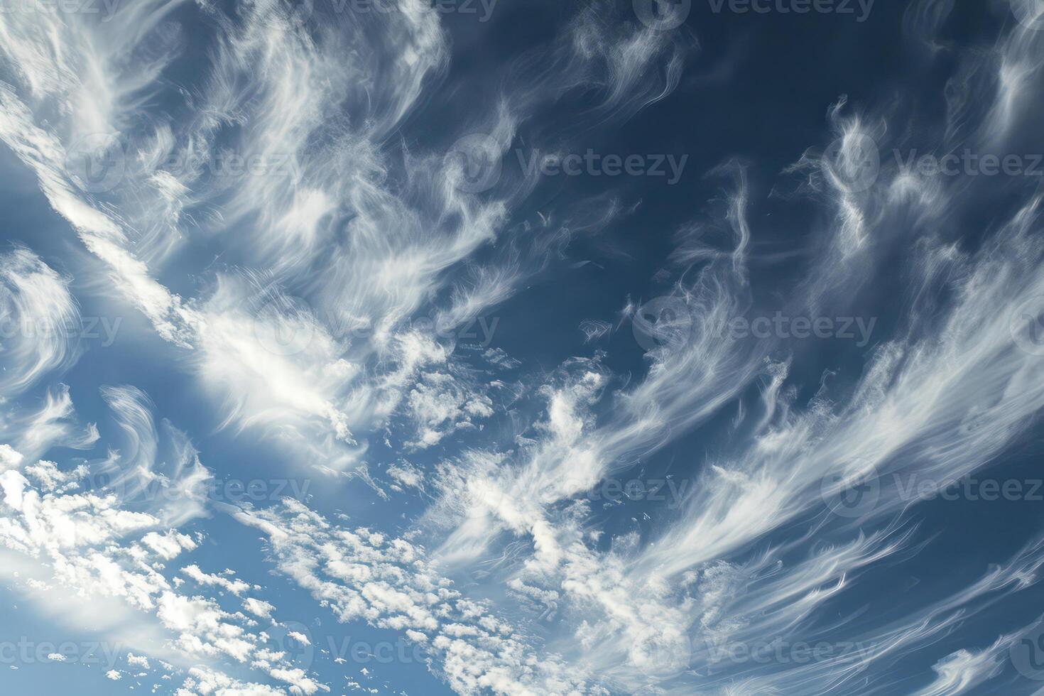 Photo of some white whispy clouds and blue sky cloudscape