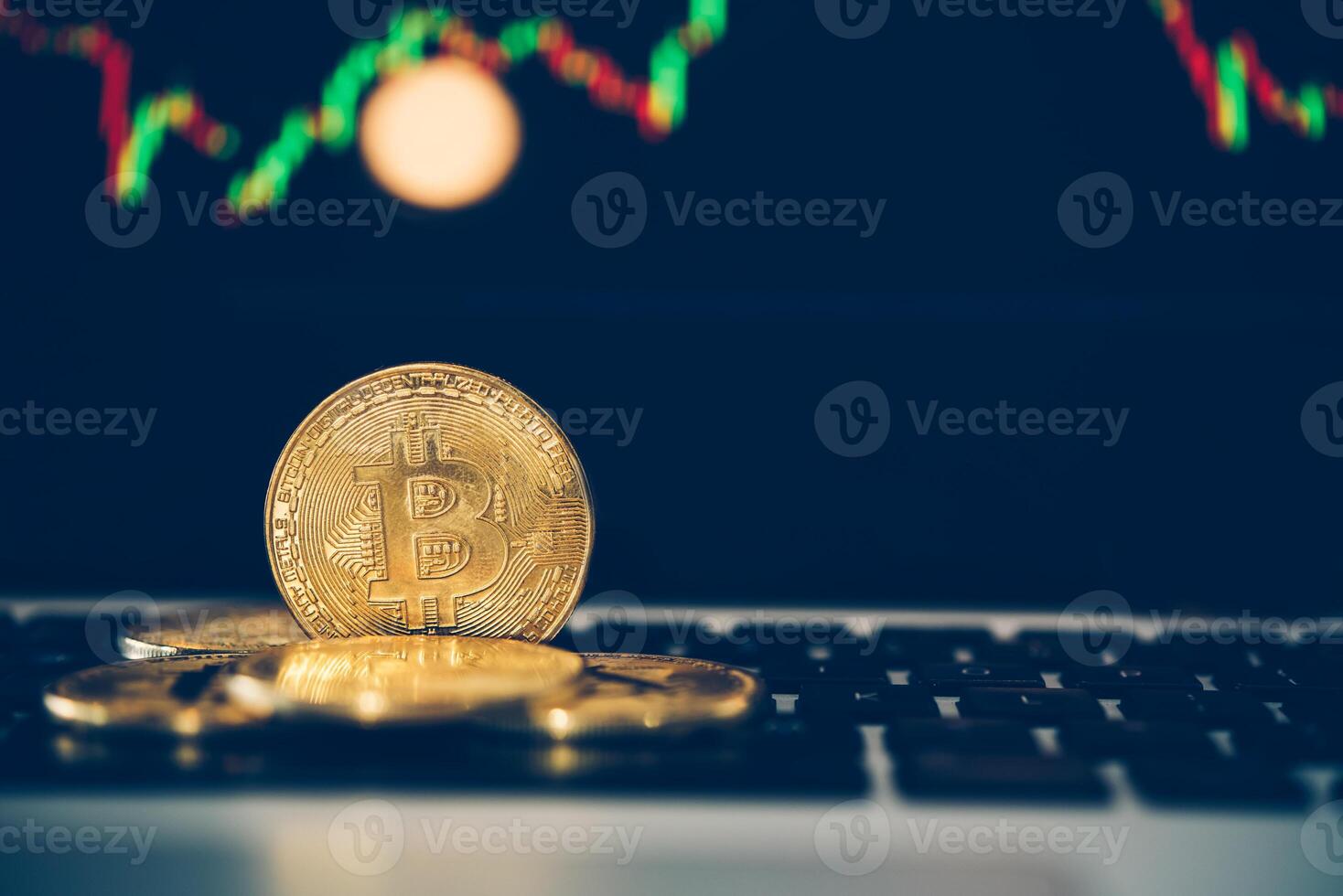 Bitcoin gold coins coin and defocused chart background photo